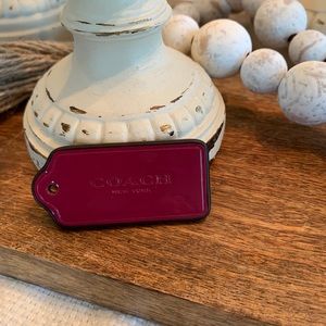 Coach purple leather hang tag